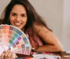 Image consultant holding a colour pallet for a colour analysis session.